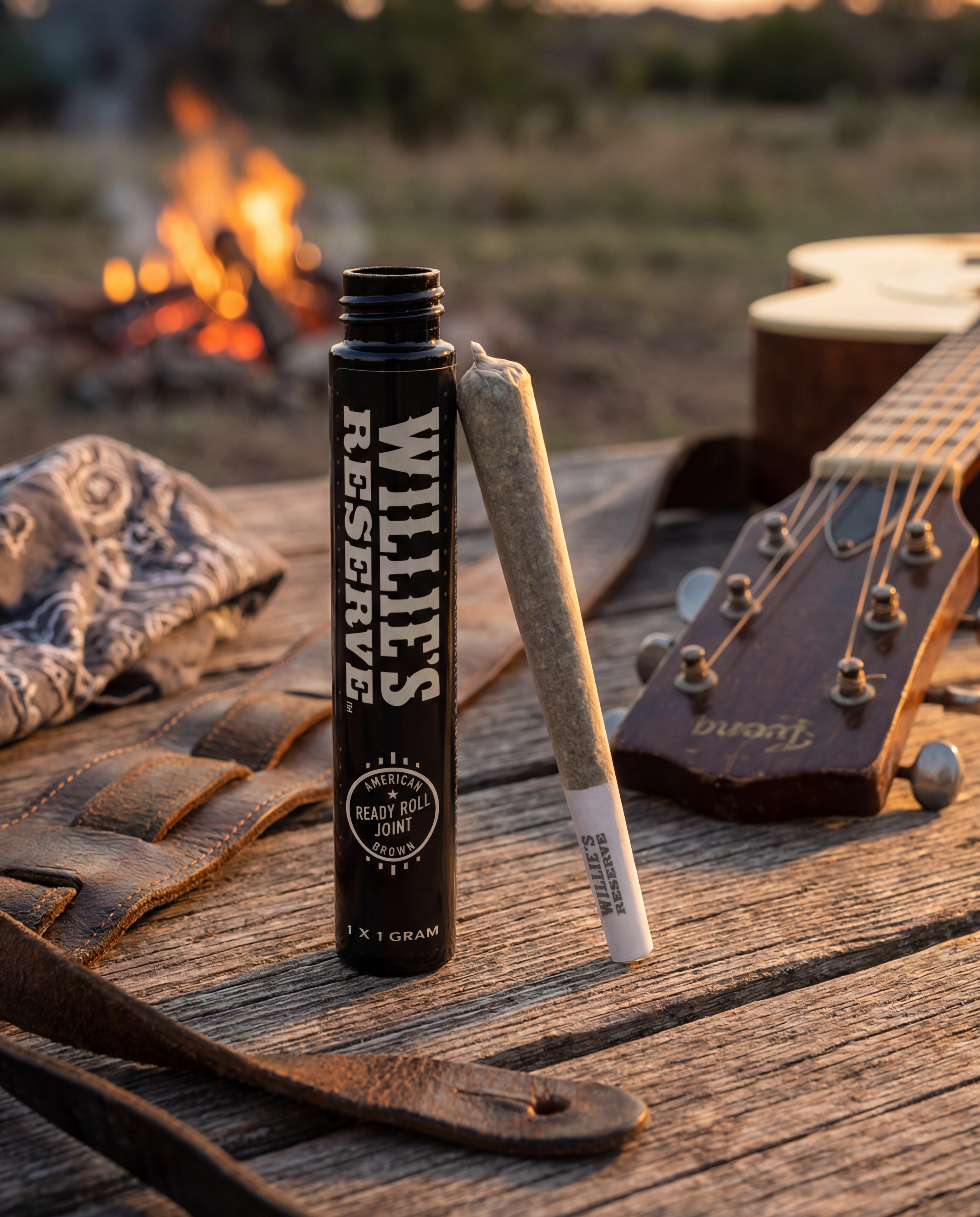 Willie's Reserve product on a wooden surface with a guitar and campfire in the background