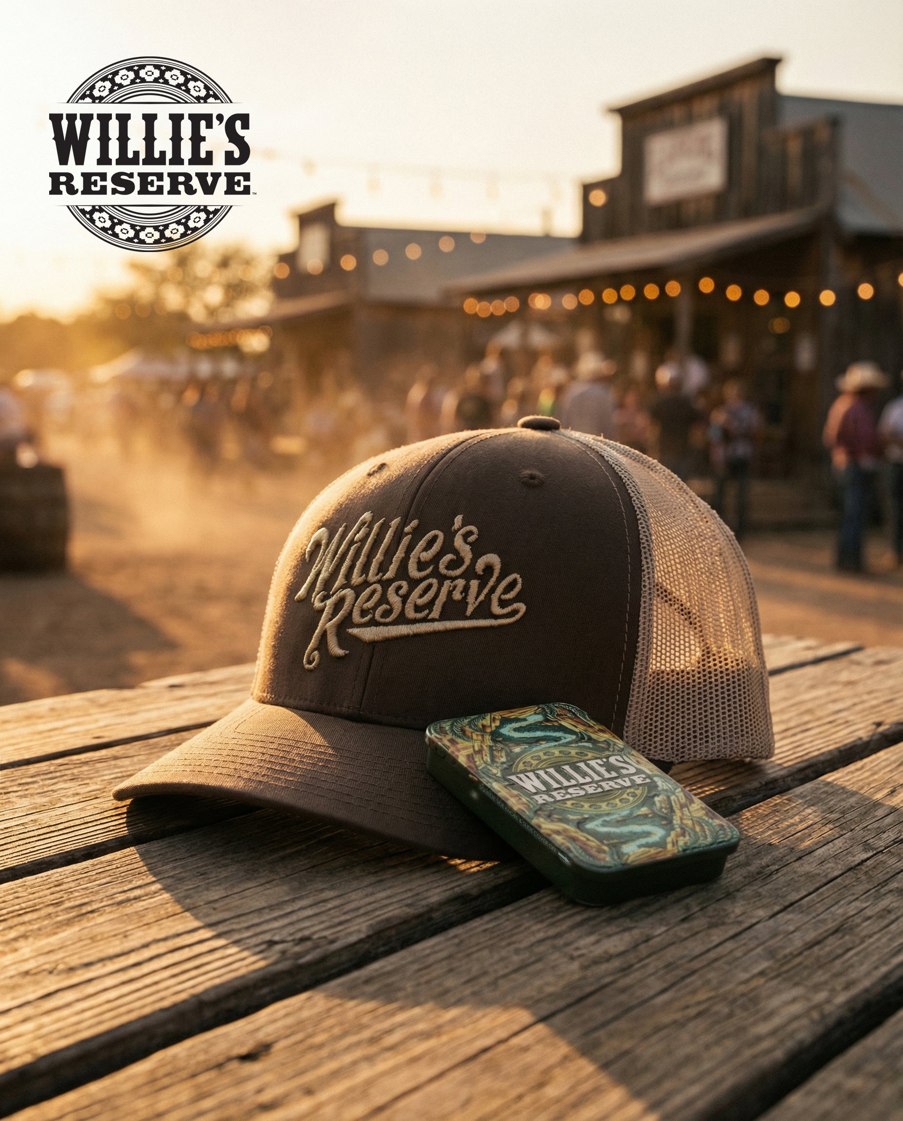 Willie's Reserve cap on a wooden surface with a western-style building in the background